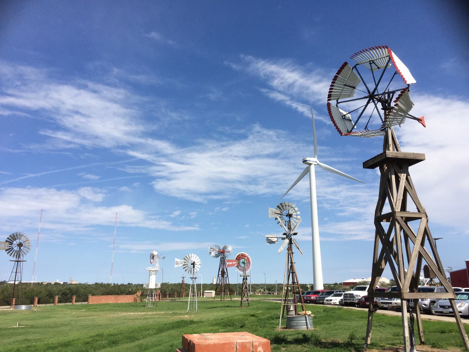 Historic wind wheels and a modern wind turbine at the American Windmill Museum in Lubbock