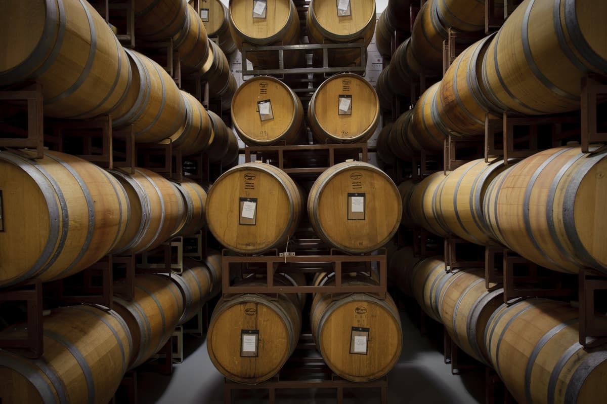 Oak wine barrels stacked in the cellar of a Texas winery