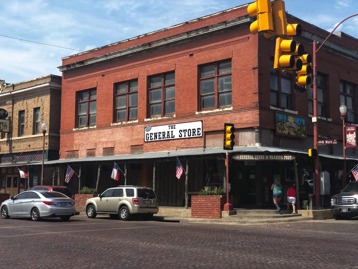 A historic red-brick general store building in the Fort Worth Stockyards